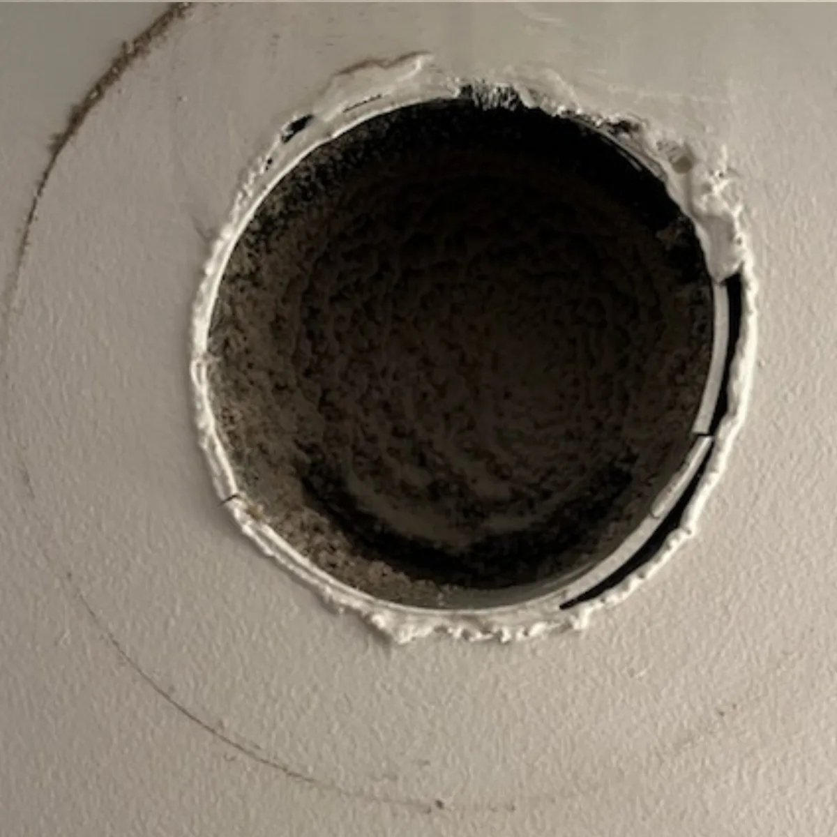 Bathroom exhaust vent before and after cleaning — before cleaning